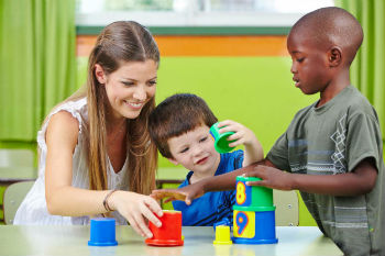 Teacher with preschoolers.